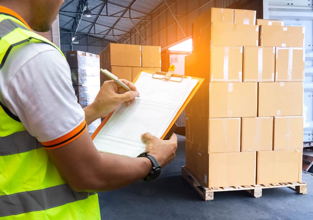 Shipping boxes and warehouse worker