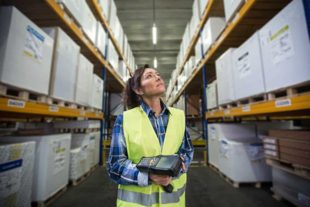 Warehouse-picker-with-RF-Wireless-Device Warehouse Worker with Radio Frequency Wireless Device